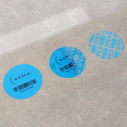 Etiqueta Circular de Seguridad con Residuo | 1,000 Pzas.